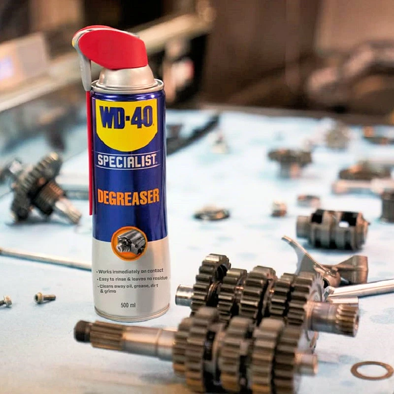 WD40 Specialist Industrial Strength Degreaser Spray 500ml with gears and tools in the background.