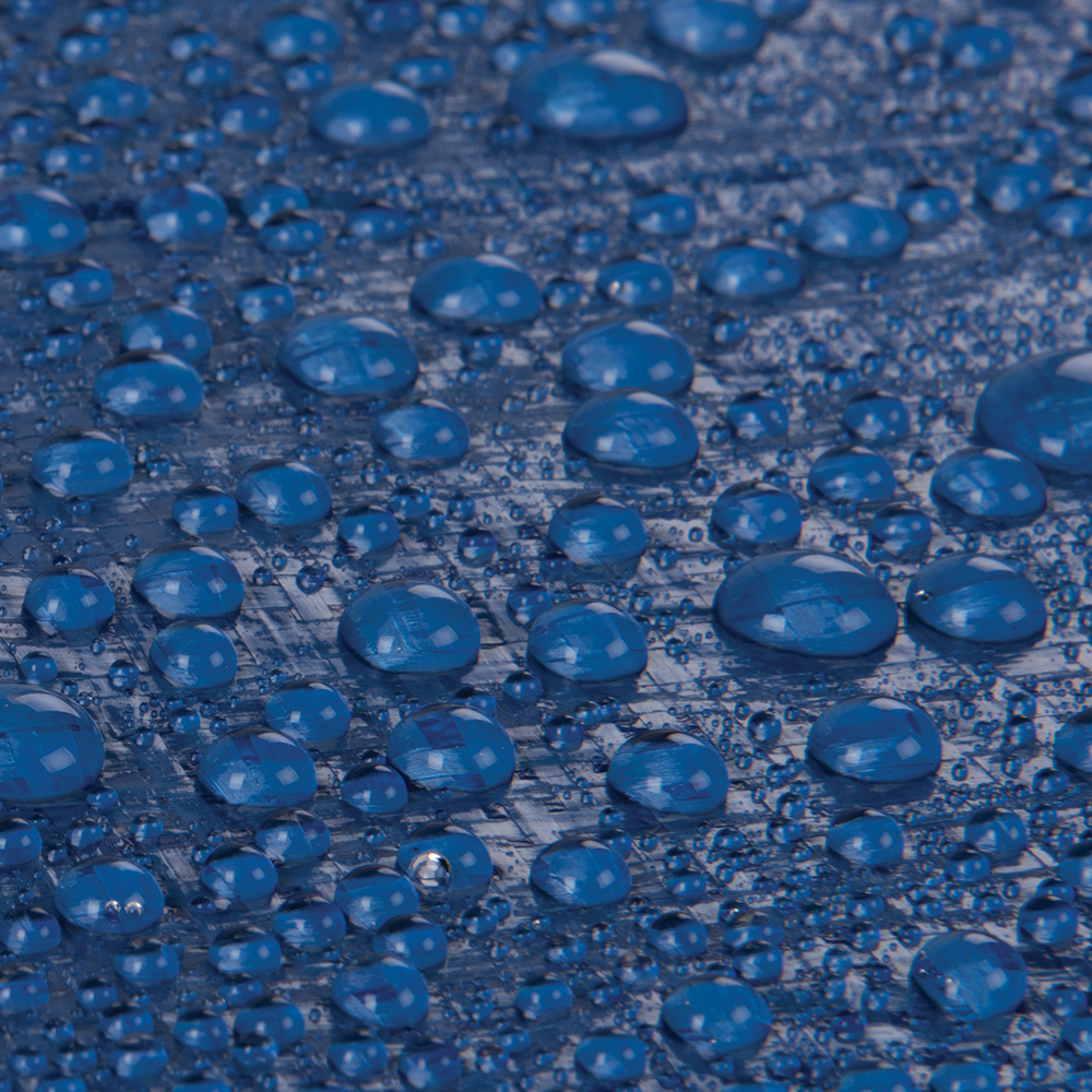 Macro image of water droplets on textured blue tarp surface representing waterproof material