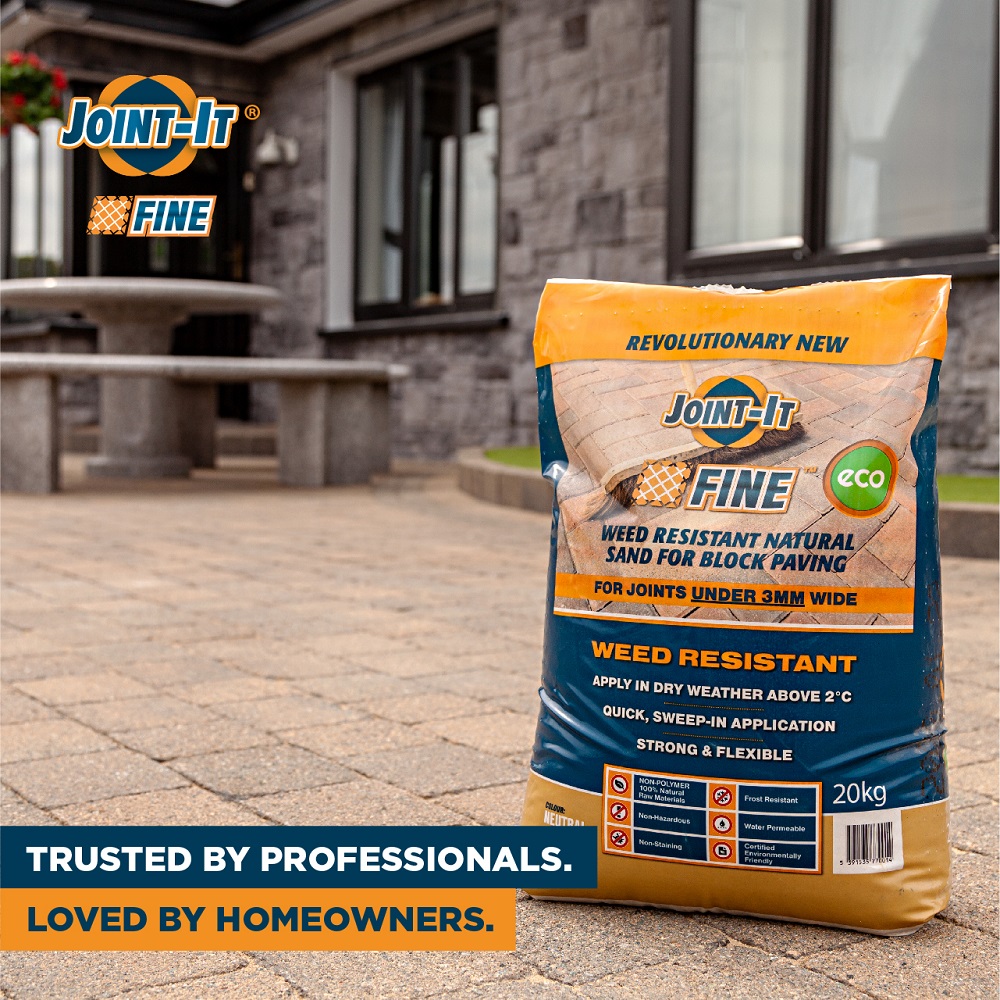 Bag of Joint-It Fine paving sand on a garden surface, used for narrow joints in paving