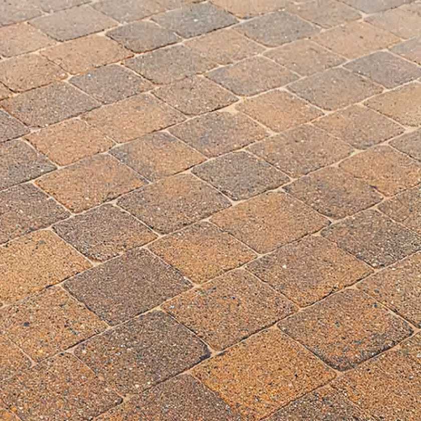 Detailed view of brick paving surface showing joints filled with paving sand