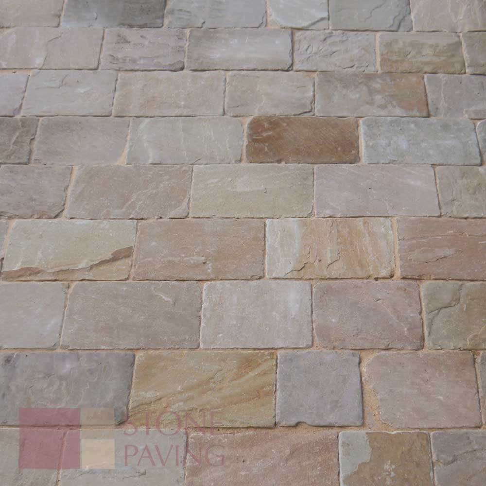 Block paving with natural colour variation, featuring freshly jointed paving sand
