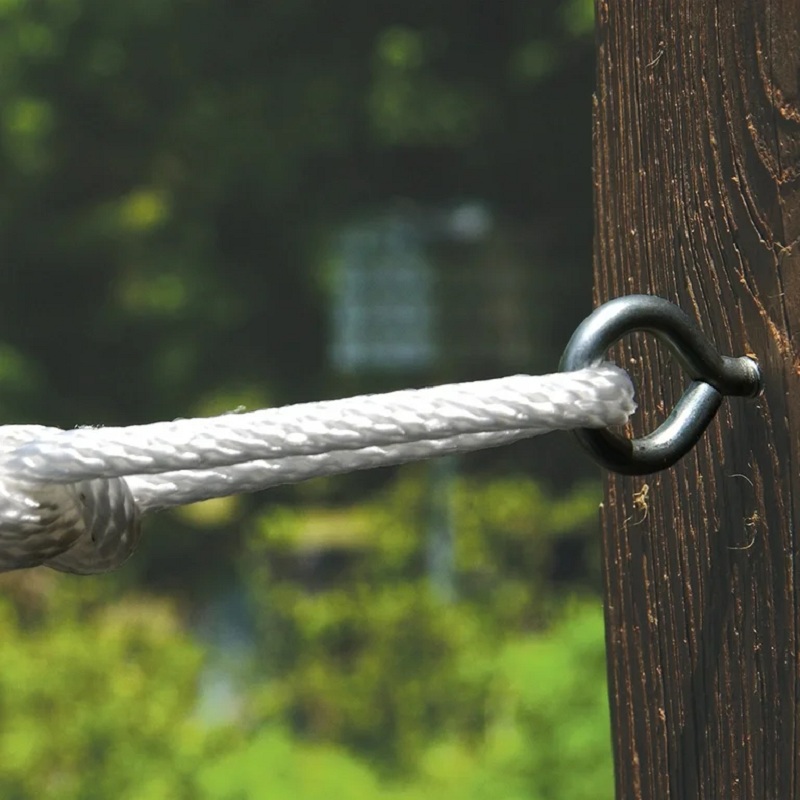 screw eye in garden fence with supporting rope attached
