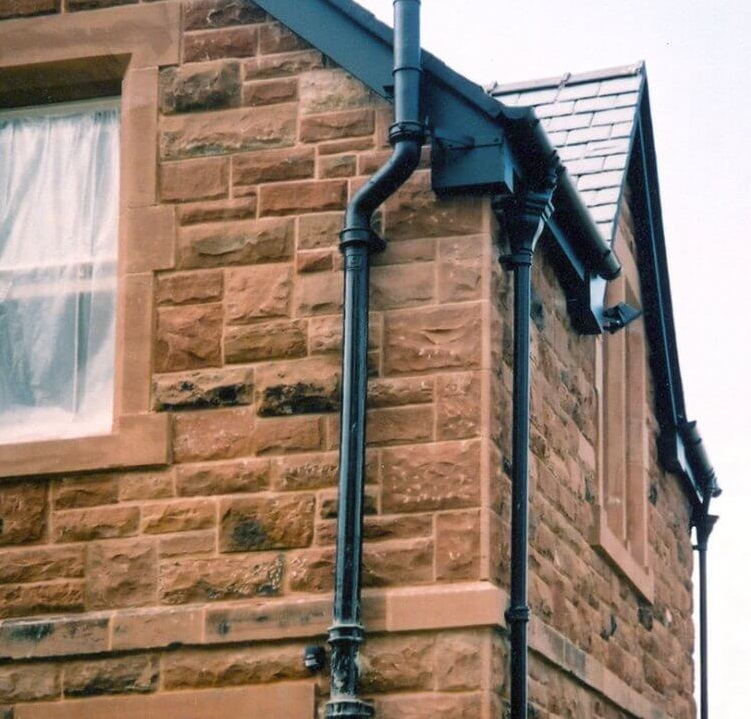 Black guttering and downpipe protected with Sika 901 Black Bitumen Paint