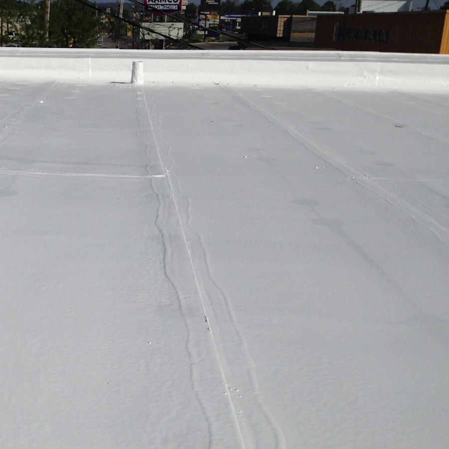 Flat roof coated with Sika Black Jack 907 Solar Reflective Paint