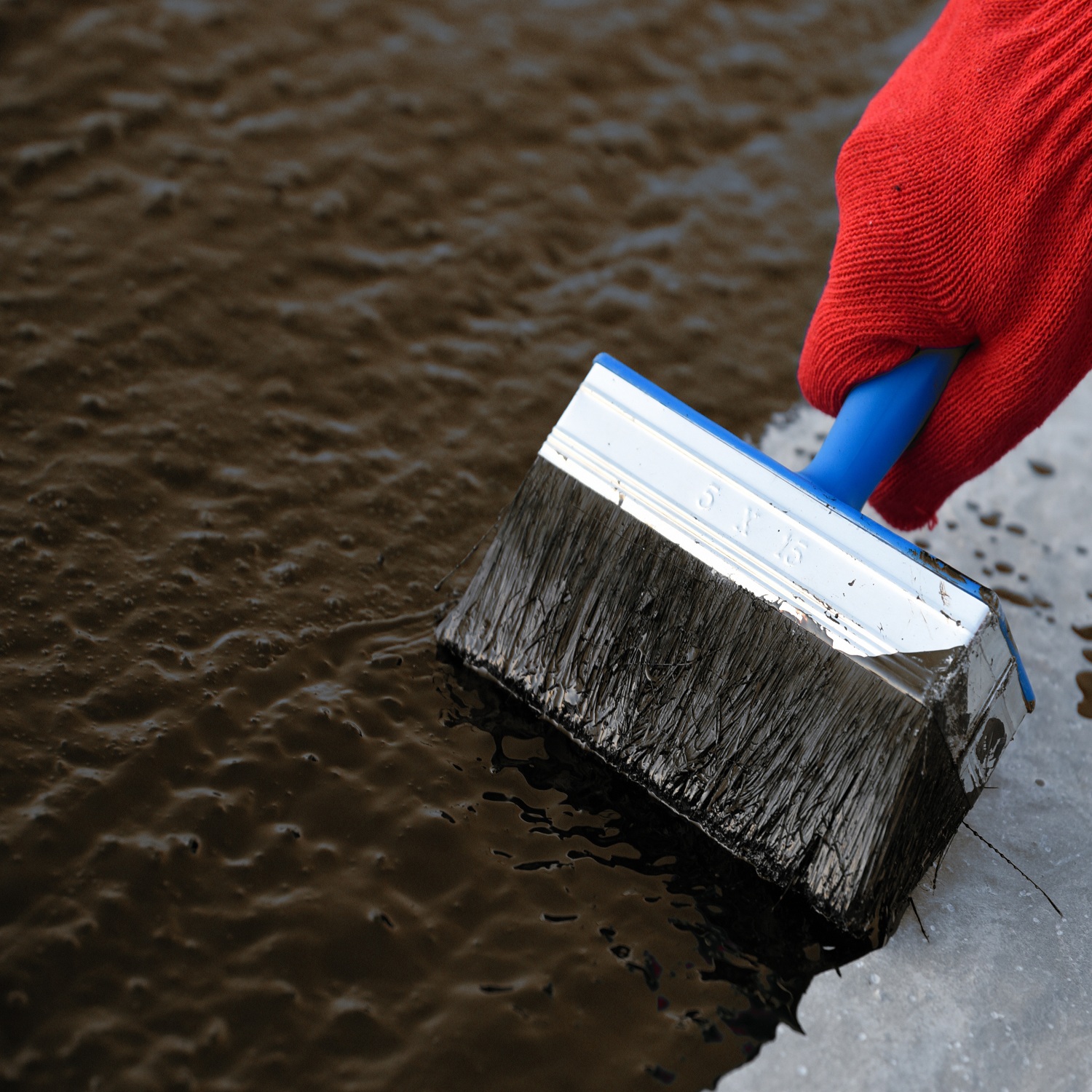 Sika Black Jack 902 Bitumen and Flashing Primer being applied with a brush