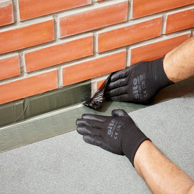 Sika Black Jack Flashing Tape applied between brickwork and flat roof surface