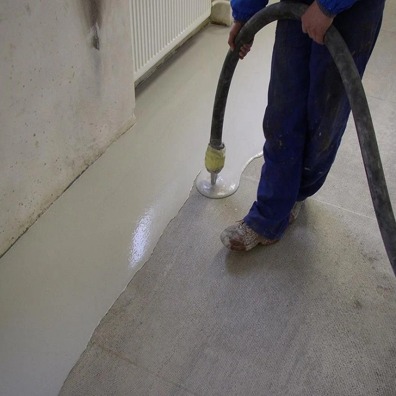 Sika Sikafloor 132 self levelling compound being pumped onto floor surface during application
