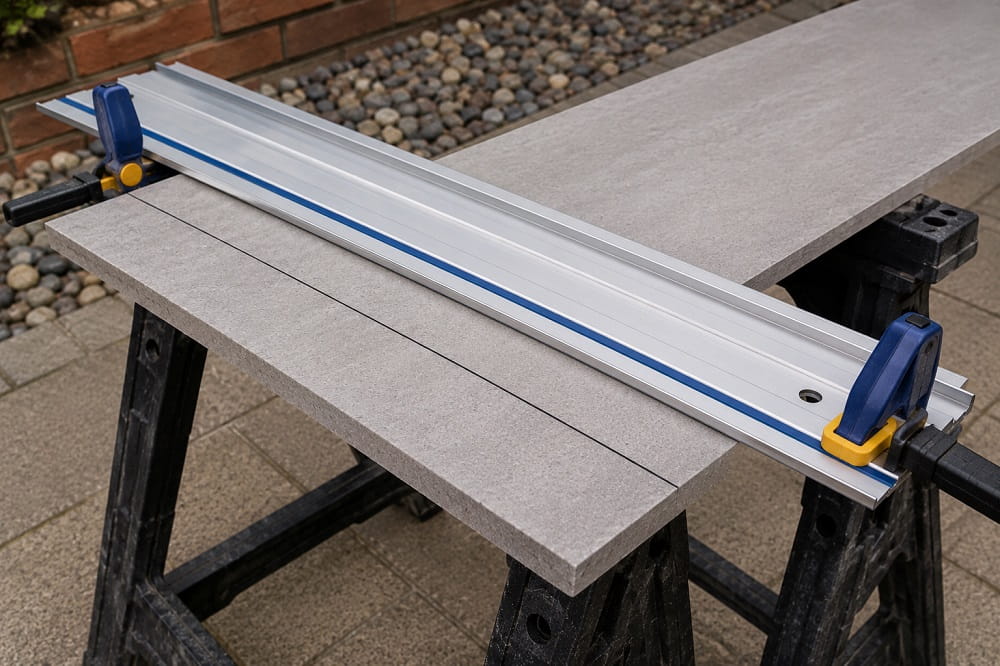 Cutting guide rail clamped to material for an accurate straight cut