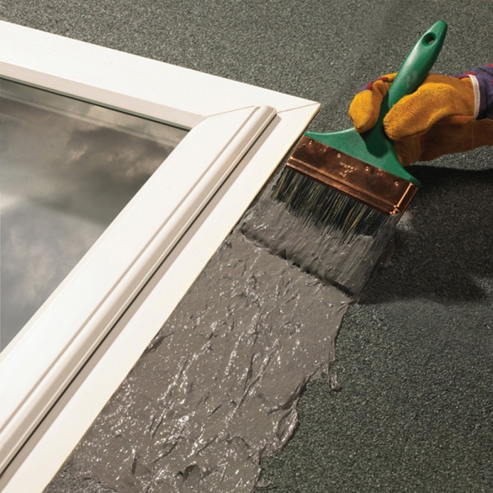 Grey Sika Evercryl fibre reinforced roof repair compound applied around a rooflight