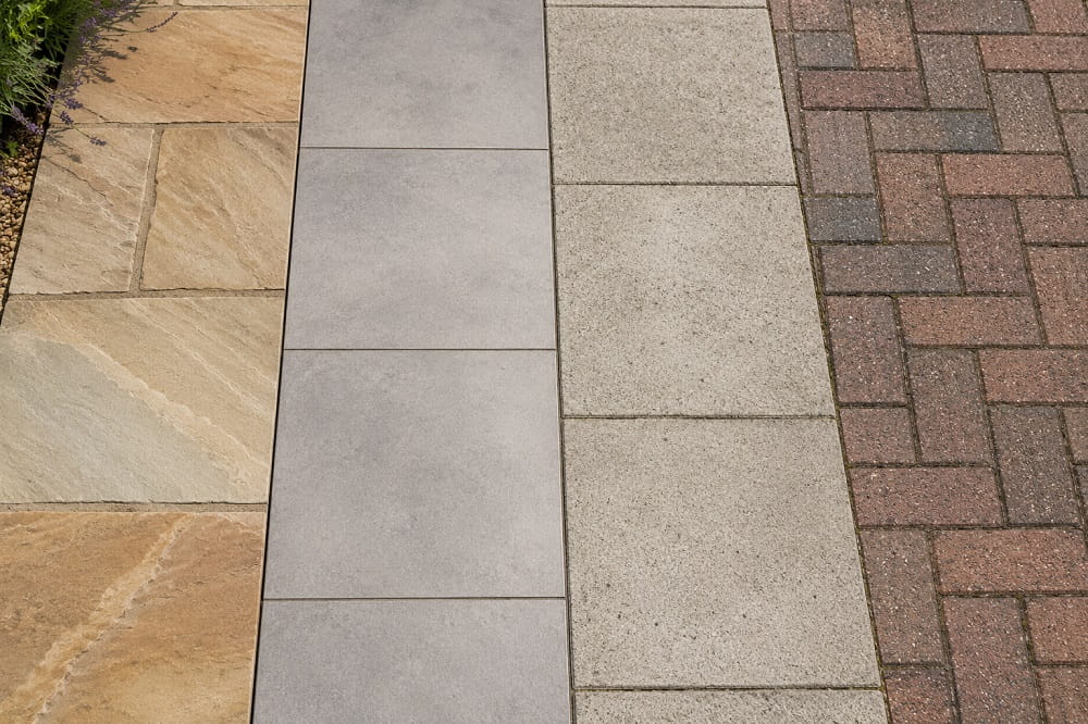 Comparison of sandstone porcelain concrete and block paving surface textures