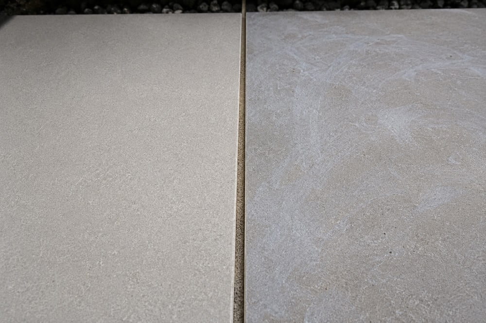 Jointing compound residue and haze visible on porcelain paving after pointing