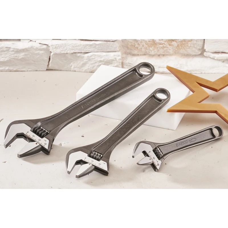 Three Bahco adjustable wrenches laid out on a pale work surface.