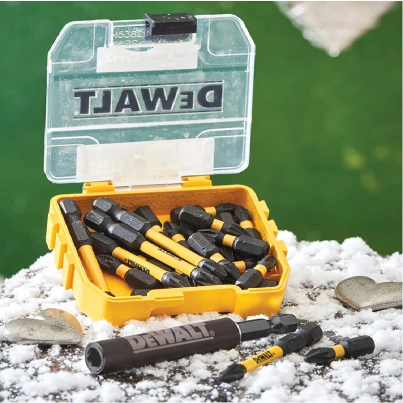 Open yellow DeWalt bit case resting on a snowy surface, with a bit holder lying in front.