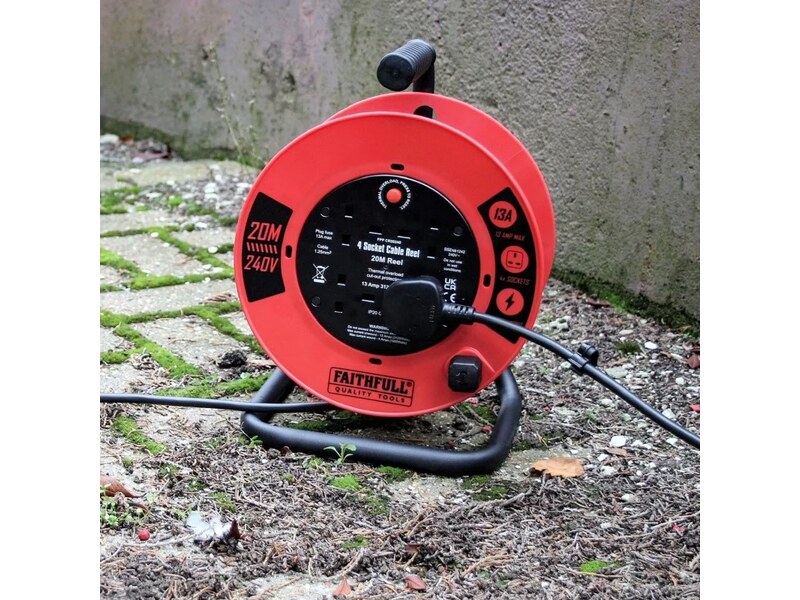 Faithfull FPPCR20240 red 20m 240V cable reel positioned outdoors with its cable extended
