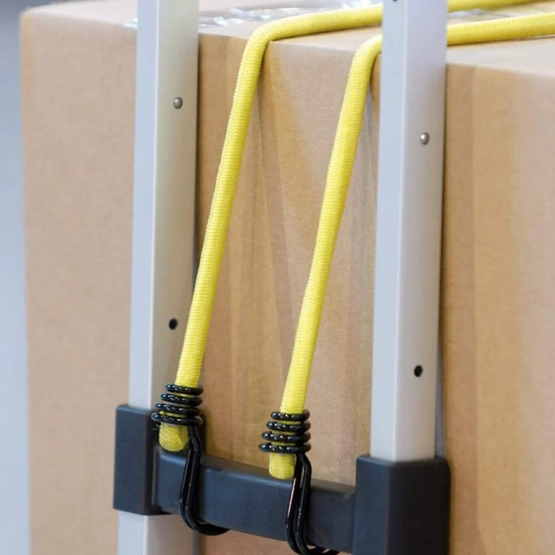 Yellow Master Lock bungee cords securing a boxed load to a trolley frame.