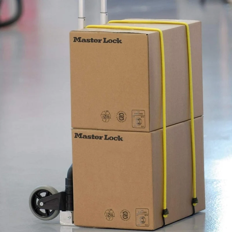 Two cardboard boxes secured to a hand trolley with yellow Master Lock bungee cords.